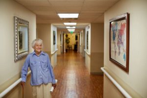 senior resident smiling in the hall