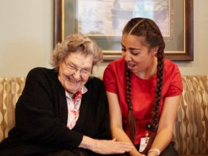 woman and caregiver smiling