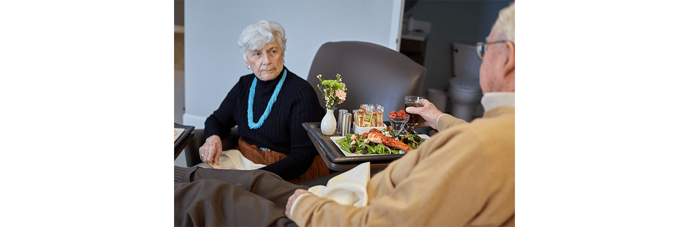 seniors having dinner and a drink